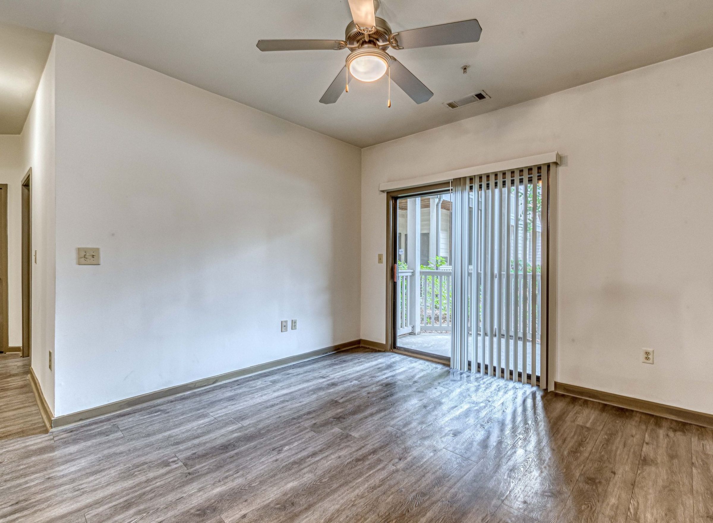 The Vue at Charlotte, NC apartment with large open-space concept kitchen, a kitchen island with stainless steel sink, granite slab countertops, and abundant custom cabinets floor to ceiling